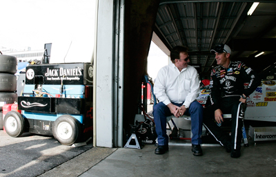 (Left to right) Richard Childress talks with his driver Clint Bowyer in the NASCAR Sprint Cup Series garage after Bowyer turned the fastest lap in Saturday's first practice at New Hampshire Motor Speedway. Bowyer will attempt to defend his Sylvania 300 title on Sunday at the track. (Photo Credit: Jason Smith/Getty Images for NASCAR)