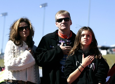 Jeff Burton, driver of the #31 AT&T Mobility Chevrolet, stands on the grid with wife Kim and daughter Paige, during the national anthem sung by 