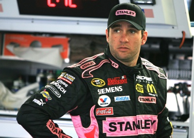 Elliott Sadler, driver of the #19 Stanley/Susan G. Komen Dodge, stands in the garage area during practice for the NASCAR Sprint Cup Series Bank of America 500 at Lowe's Motor Speedway on October 9, 2008 in Concord, North Carolina. (Photo by Jerry Markland/Getty Images for NASCAR)