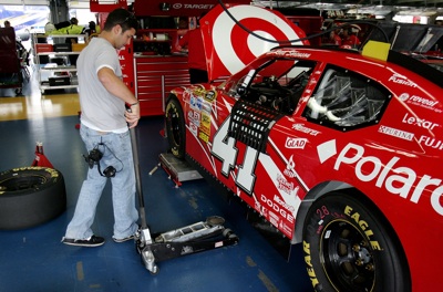 Reed Sorenson helps in the garage during NASCAR Sprint Cup Series testing at Lowe's Motor Speedway. Jeremy Mayfield tested the No. 41 Target Dodge normally driven by Sorenson. (Photo Credit: Streeter Lecka/Getty Images for NASCAR)
