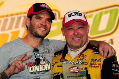American Idol runner-up and recording artist Bo Bice celebrates with Todd Bodine, winner of the NASCAR Craftsman Truck Series Mountain Dew 250 fueled by Winn-Dixie at Talladega Superspeedway in Talladega, Ala. on Saturday. (Photo Credit: Rusty Jarrett/Getty Images for NASCAR)