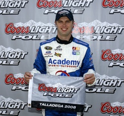 Travis Kvapil celebrates his first career NASCAR Sprint Cup Series pole on Saturday at Talladega Superspeedway in Talladega, Ala. He'll start first in Sunday's AMP Energy 500 after turning the fastest lap at 187.364 mph. (Photo Credit: Jason Smith/Getty Images for NASCAR)