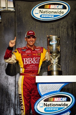 Clint Bowyer, driver of the #2 BB&T Chevrolet, poses after winning the 2008 NASCAR Nationwide Series Championship after the Ford 300 at Homestead-Miami Speedway on November 15, 2008 in Homestead, Florida (Getty Images for NASCAR)