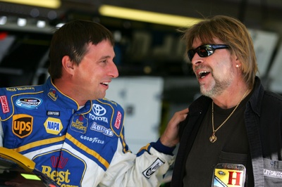 David Reutimann shares a laugh with Phil Harris of The Deadliest Catch. (Photo Credit: Todd Warshaw/Getty Images for NASCAR)