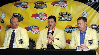 Tony Stewart (center) is introduced as the Grand Marshall of the upcoming Fiesta Bowl by Chairman of the Board Dave Tilson (left) and Executive Director John Junker (right). (Photo Credit: Rusty Jarrett/Getty Images for NASCAR)