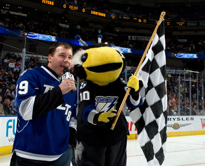Defending Daytona 500 champion Ryan Newman starts the game between the Tampa Bay Lightning and the Philadelphia Flyers with Lightning mascot Thunderbug saying 'Let's Play Hockey' at the St. Pete Times Forum on January 15, 2009 in Tampa, Fla. (Photo Credit: Scott Audette/NHLI via Getty Images)