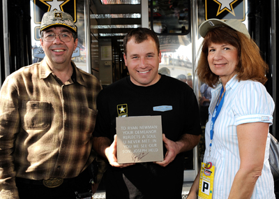 Steve and Christine Deuker meet NASCAR Sprint Cup Series driver Ryan Newman (center) on Saturday at Daytona International Speedway. The Deukers honored Newman and their son, who passed away in 2001, by buying a brick from the NASCAR Hall of Fame. (Photo Credit: Rusty Jarrett/Getty Images for NASCAR)