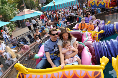 Four-time NASCAR Cup Series champion and three-time Daytona 500 winner Jeff Gordon (left) takes a spin with his wife Ingrid (right) and two-year-old daughter Ella (front right) February 9, 2009 on the Magic Carpets of Aladdin attraction at the Magic Kingdom in Lake Buena Vista, Fla. Gordon visited the Walt Disney World theme parks the week leading up to the 51st running of the Daytona 500. (Photo Credit: Garth Vaughan and Walt Disney World)