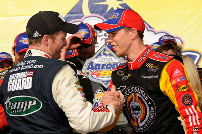 Dale Earnhardt Jr. (left), driver of the No. 88 National Guard/Amp Energy Chevrolet, congratulates Brad Keselowski (right), driver of the No. 09 Miccosukee Chevrolet, in Victory Lane on his first Sprint Cup Series win at the NASCAR Sprint Cup Series Aaron's 499 at Talladega Superspeedway. (Photo Credit: Rusty Jarrett/Getty Images for NASCAR)
