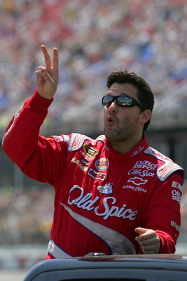 Tony Stewart, driver of the No. 14 Old Spice Chevrolet, waves to the fans following driver introductions and before the start of Sunday's NASCAR Sprint Cup Series Aaron's 499 at Talladega Superspeedway. (Photo Credit: Todd Warshaw/Getty Images)