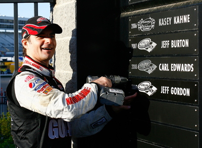 Jeff Gordon, driver of the #24 DuPont Chevrolet, adds his name to the Wall of Champions after winning the NASCAR Sprint Cup Series Samsung 500 at Texas Motor Speedway on April 5, 2009 in Fort Worth, Texas. (Photo by Jason Smith/Getty Images for Texas Motor Speedway)