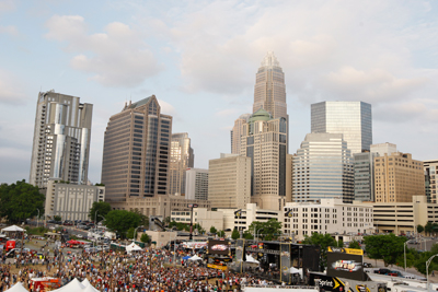 In the shadows of the Charlotte skyline, NASCAR fans gather for NASCAR Rev'd Up in Uptown Charlotte to kick off NASCAR Sprint All-Star Race week on Wednesday. (Photo Credit: Chris Keane/Getty Images for Sprint)