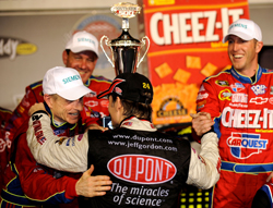 (Center) Jeff Gordon congratulates Hendrick Motorsports teammate Mark Martin and No. 5 crew chief Alan Gustafson in Darlington Raceway's Victory Lane after Martin won the NASCAR Sprint Cup Series Southern 500 Presented by GoDaddy.com on Saturday. (Photo Credit: Rusty Jarrett/Getty Images for NASCAR)