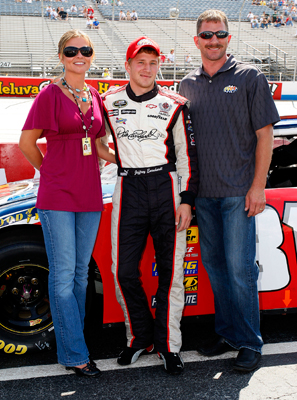 (Center) Jeffrey Earnhardt stands between his stepmother Rene and father Kerry before Jeffrey attempts to make his first NASCAR Nationwide Series race. Earnhardt was off of Kertus Davis' time by two-tenths of a second in qualifying Saturday at Dover International Speedway and was the only driver not to make the race. (Photo Credit: Jason Smith/Getty Images for NASCAR)