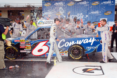 The No. 6 Con-way Freight Ford Roush Fenway Racing team congratulate first-time NASCAR Camping World Truck Series winner Colin Braun in Victory Lane after the Michigan 200 Saturday at Michigan International Speedway in Brooklyn, Mich. (Photo Credit: Geoff Burke/Getty Images for NASCAR)
