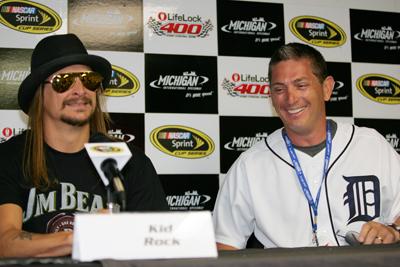 (Left to right) Kid Rock and the NFL's Detroit Lions head coach Jim Schwartz meet Sunday before the NASCAR Sprint Cup Series LifeLock 400 at Michigan International Speedway in Brooklyn, Mich. (Photo Credit: Todd Warshaw/Getty Images for NASCAR)