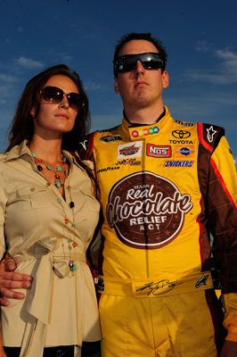 Kyle Busch, driver of the No. 18 M&M's Toyota, stands with his girlfriend Samantha Sarcinella during pre-race activities Saturday at Chicagoland Speedway before the start the NASCAR Sprint Cup Series LifeLock.com 400 in Joliet, Ill. (Photo Credit: Rusty Jarrett/Getty Images for NASCAR)