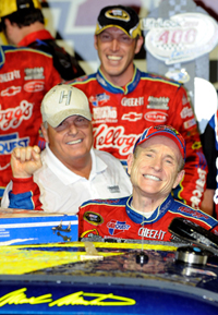 Team owner Rick Hendrick (left) and crew chief Alan Gustafson (top) celebrate with Mark Martin (right), driver of the No. 5 CARQUEST/Kellogg's Chevrolet, celebrates with in the Victory Lane after winning Saturday night's NASCAR Sprint Cup Series LifeLock.com 400 at Chicagoland Speedway. (Photo Credit: John Harrelson/Getty Images)