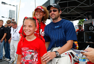 Patrick Dempsey, driver for Dempsey Racing, poses for a picture with Tony Stewart fans prior to the start of the Rolex Grand-Am Sports Car Series Brumos Porsche 250 at Daytona International Speedway on Saturday in Daytona Beach, Fla. (Photo Credit: Geoff Burke/Getty Images for NASCAR)