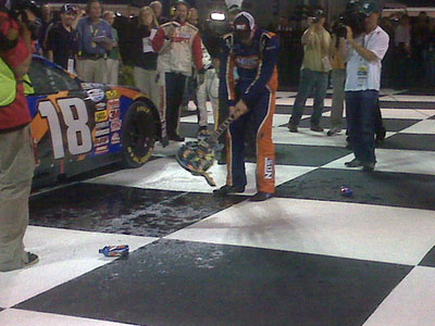 Kyle Busch smashes the guitar trophy at Nashville. (photo credit: Nationwide)