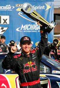 Race polesitter Brian Vickers, driver of the No. 83 Red Bull Toyota, celebrates with his firt trip to Michigan International Speedway's Victory Lane after winning the NASCAR Sprint Cup Series CARFAX 400 on Sunday. (Photo Credit: Jerry Markland/Getty Images for NASCAR)