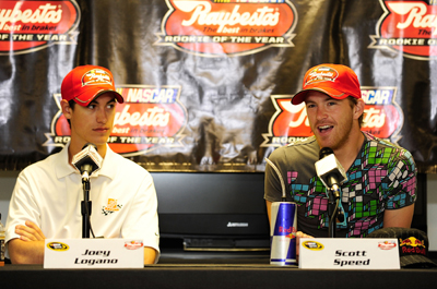 (Left to right) Raybestos Rookie of the Year Contenders Joey Logano, driver of the No. 20 Home Depot Toyota, and Scott Speed, driver of the No. 82 Red Bull Toyota, meet the media on Friday at Pocono Raceway during NASCAR Sprint Cup Series Sunoco Red Cross Pennsylvania 500 race weekend. (Photo Credit: Rusty Jarrett/Getty Images for NASCAR)