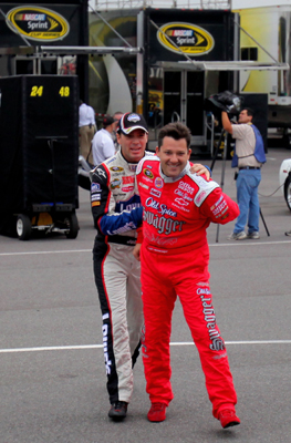 (Left to right) Jimmie Johnson, driver of the No. 48 Lowe's Chevrolet, grabs Tony Stewart, driver of the No. 20 Old Spice Swagger Chevrolet, as the two joked in the Pocono Raceway garage Friday before practice for the NASCAR Sprint Cup Series Sunoco Red Cross Pennsylvania 500. (Photo Credit: Doug Pensinger/Getty Images)