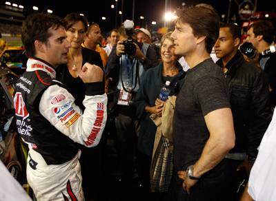 Tom Cruise, who is becoming a regular at NASCAR races, chats with Jeff Gordon on pit road prior to the Chevy Rock & Roll 400 at Richmond International Raceway. (Photo Credit: Streeter Lecka/Getty Images)