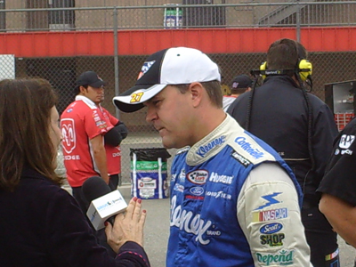 Jason Keller chats with Sirius Satellite Radio's Claire B. Lang after his qualifying run for the Copart 300 on Saturday, October 10, 2009 at Auto Club Speedway in Fontana, CA (photo credit: The Fast and the Fabulous)