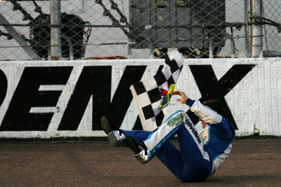 Edwards was unable to do his trademark backflip because of his previously broken foot, so he did a somersault to celebrate his win for the fans at Phoenix International Raceway. (Photo Credit: Todd Warshaw/Getty Images for NASCAR)