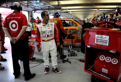 Juan Pablo Montoya, driver of the No. 42 Target/Dream in Color Chevrolet, stands in the garage as crew members work on the car following a lap 176 accident in Turn 1 involving Brad Keselowski, Jeff Gordon and Carl Edwards during Sunday's NASCAR Sprint Cup Seris Dickies 500 at Texas Motor Speedway on November 8, 2009 in Fort Worth, Texas. Montoya finished the race in 37th place and is sixth in the Chase for the Sprint Cup, 236 points behind points leader Jimmie Johnson. (Photo Credit: Rusty Jarrett/Getty Images for NASCAR)