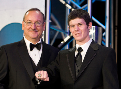 NASCAR's George Silbermann presents the NASCAR championship ring to Ryan Truex. (Photo Credit: Chris Keane/Getty Images for NASCAR)