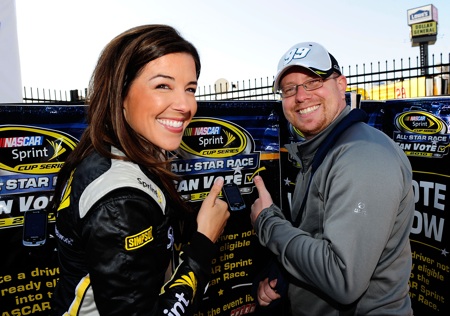 Miss Sprint Monica Palumbo poses with James Bryant of Clover, S.C., after he cast the first official fan vote for the NASCAR Sprint All-Star race during testing at Charlotte Motor Speedway on Wednesday.(Credit: Rusty Jarrett/Getty Images for NASCAR)