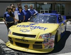 (Front row, left to right) Taylor Earnhardt, Teresa Earnhardt, Kelley Earnhardt, Dale Earnhardt Jr., Richard Childress (Back row left to right) Wrangler VP of Marketing Craig Errington and Kerry Earnhardt stand behind the No. 3 NASCAR Nationwide Series new car at JR Motorsports in Mooresville, N.C. on Thursday. Earnhardt Jr. will run it July 2 at Daytona International Speedway. Credit: Mary Ann Chastain/Getty Images for NASCAR