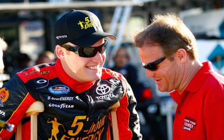 Steve Wallace (with crutches) chats with uncle Kenny Wallace before Friday's final practice for the Bashas' Supermarkets 200 at Phoenix International Raceway.(Credit: Geoff Burke/Getty Images for NASCAR)