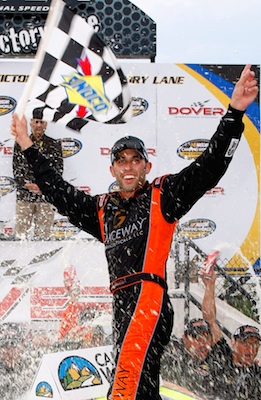 Aric Almirola celebrates his first NASCAR Camping World Truck Series win in Victory Lane at Dover International Speedway. He called the win a dream come true. (Credit: Geoff Burke/Getty Images for NASCAR)