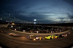 Racing under the lights at Richmond International Raceway on Saturday. (Credit: Al Bello/Getty Images for NASCAR)