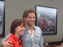 Actor Bradley Cooper takes a photo with a fan at Charlotte Motor Speedway on Sunday, May 30th, 2010 (photo credit: The Fast and the Fabulous)