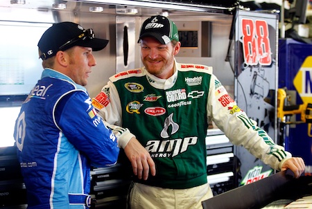 (Left to right) Jamie McMurray and his NASCAR Nationwide Series owner Dale Earnhardt Jr. talk during NASCAR Sprint Cup Series practice Saturday at Michigan International Speedway in Brooklyn, Mich.