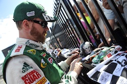 Dale Earnhardt Jr., driver of the No. 88 AMP Energy/National Guard Chevrolet, signs autographs for race fans during the Aug. 1 NASCAR Sprint Cup Series event at Pocono Raceway (Courtesy Hendrick Motorsports).