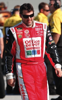 Tony Stewart wears the firesuit that's up for auction at OfficeDepotRacing.com