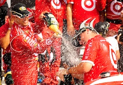 (Left to right) Juan Pablo Montoya and crew chief Brian Pattie spray each other with champagne in Watkins Glen International's Victory Lane after Pattie claimed his first victory atop the box in the NASCAR Sprint Cup Series on Sunday at Watkins Glen International in Watkins Glen, N.Y. (Credit: Rusty Jarrett/Getty Images for NASCAR)