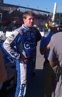 Carl Edwards waits to be interviewed post-qualifying for the CampingWorld.com 300 at Auto Club Speedway in Fontana, Calif. on Saturday, October 9, 2010 (credit: The Fast and the Fabulous)