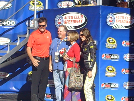 Couples take photos with Michael Waltrip and Miss Sprint Cup