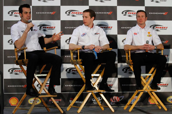 (Left to right) Sam Hornish Jr., driver of the No. 12 Alliance Truck Parts Dodge in the NASCAR Nationwide Series, speaks to the media as NASCAR Sprint Cup Series teammates Brad Keselowski, driver of the No. 2 Miller Lite Dodge, and Kurt Busch, driver of the No. 22 Shell/Pennzoil Dodge, look on during the NASCAR Sprint Media Tour hosted by Charlotte Motor Speedway, held at Penske Racing on Monday in Mooresville, N.C.(Credit: Jason Smith/Getty Images for NASCAR)