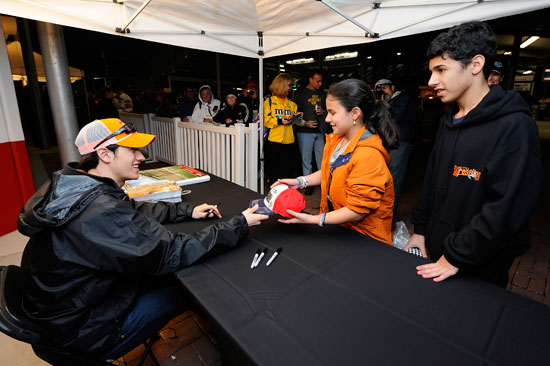 Joey Logano who was third fastest with a lap time of 45.757 seconds signs autographs for fans during Preseason Thunder Fan Fest on Friday at Daytona International Speedway in Daytona Beach, Fla.(Credit: Jared C. Tilton/Getty Images for NASCAR)