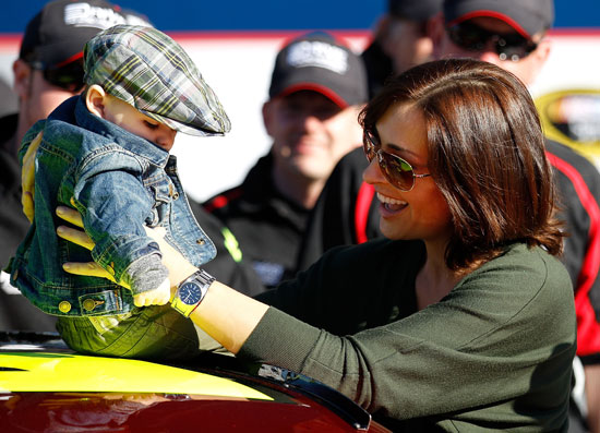 Jeff Gordon's wife Ingrid Vandebosch and his son Leo in victory lane after Jeff Gordon secured a front row start for the Daytona 500 at Daytona International Speedway in Daytona Beach, Fla. (Credit: Chris Graythen/Getty Images for NASCAR)