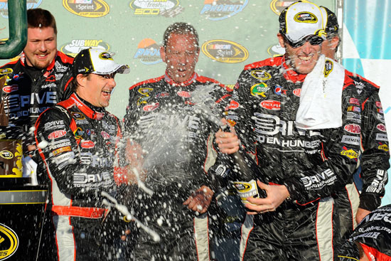 Jeff Gordon douses new crew chief Alan Gustafson with champagne after ending his 66-race winless streak with his SUBWAY Fresh Fit 500 victory. (Credit: Jared C. Tilton/Getty Images for NASCAR)