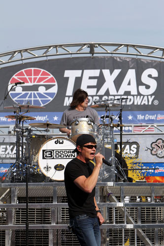 Lead singer Brad Arnold and drummer Greg Upchurch of 3 Doors Down perform prior to the NASCAR Sprint Cup Series Samsung Mobile 500 at Texas Motor Speedway on Saturday in Fort Worth, Texas. (Credit: Jonathan Ferrey/Getty Images for NASCAR)