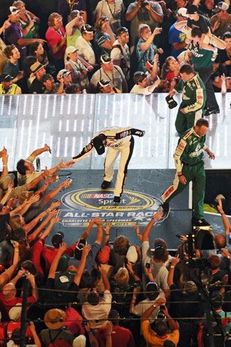 Dale Earnhardt Jr. greets his fans after being announced as the Sprint Fan Vote winner which transferred him into his 12th straight NASCAR Sprint All Star Race. (Credit: Drew Hallowell/Getty Images for NASCAR)